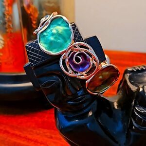 NWOT Gold toned purple green bangle bracelet with geometric shapes